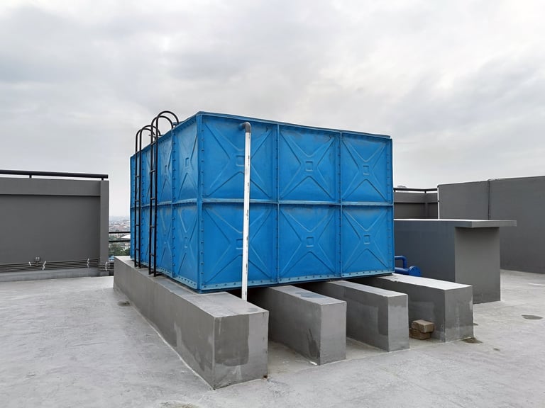 Blue Water Tank with Valve and Piping installed on roof
